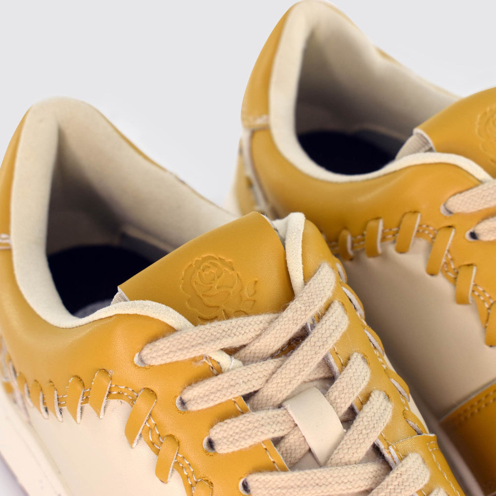 
                  
                    Eco-Leather Tressé Sneakers - Mustard
                  
                